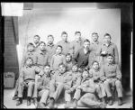 Seventeen male Cheyenne students with a white man, 1890