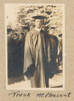 Frank Mt. Pleasant at Graduation sepia toned photograph of man standing in cap and gown