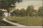 color image; view from the superintendent's quarters looking north showing the path to the teacher's quarters and the band stand